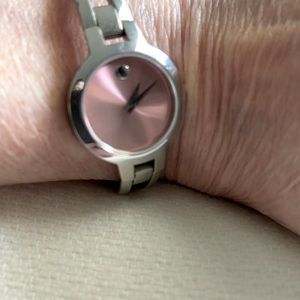 Movado pink face with sapphire crystal ladies watch.